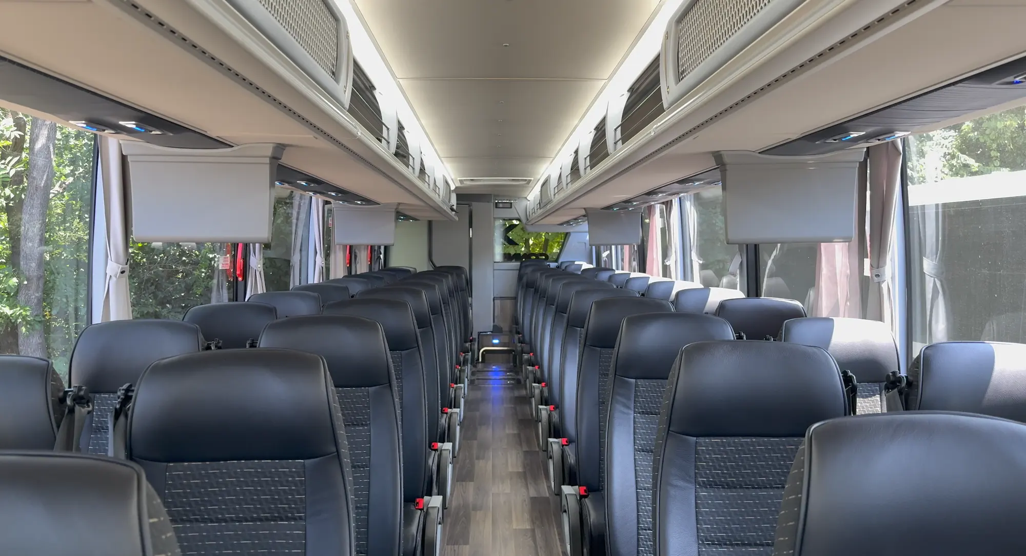 Charter bus amenities including power outlets and WiFi for wedding guests