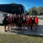 Sports team transportation - athletes boarding a Connexxions charter bus